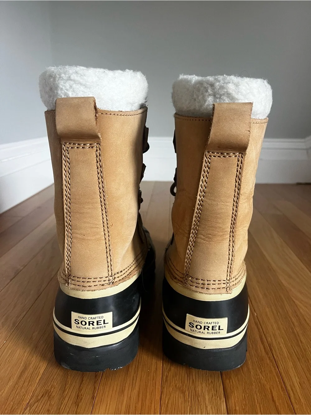Sorel Tan and Black Caribou Winter Boots
